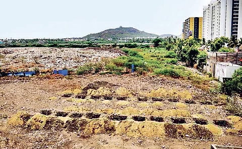 The holes dug up by Pallavaram Municipality on Periya Eri lake bed for constructing compost facility | Express