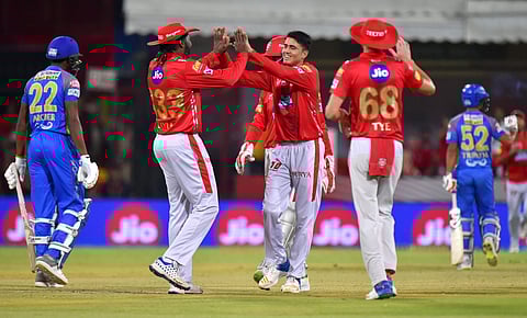 Kings XI Punjab team players celebrates wicket of Rajasthan Royals' Ajinkya Rahane during an IPL2018 cricket match at MPCA Holkar Stadium in Indore on Sunday. | PTI