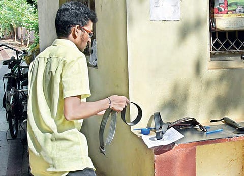 A NEET candidate leaves his belt outside an examination hall at a centre in Vijayawada on Sunday | Express