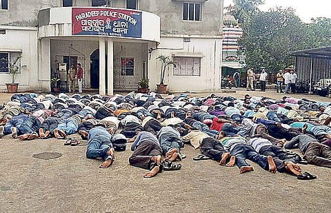 Retrenched workers of Cargill, India stage lie-in protest in front of Paradip police station on Monday | Express