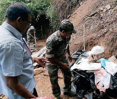 Officials under the leadership of Munnar special tahsildar K Sreekumar dismantle sheds constructed by encroachers on government land in Munnar | Express