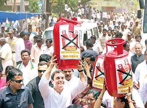 Congress president Rahul Gandhi carrying a replica of an LPG cylinder to protest against the rise in fuel prices at Malur on Monday | NAGARAJA GADEKAL