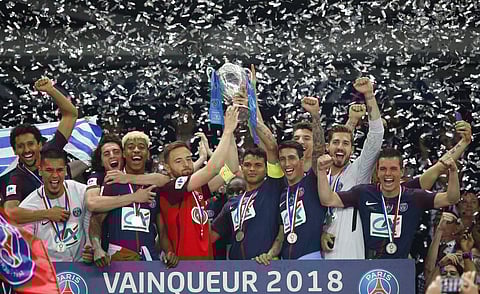 1 1 2 3 4 5 6 7 8 9 10 PSG's Thiago Silva, center right, with Les Herbiers' Sebastien Flochon, center left, lift up the trophy with the whole PSG team after the French Cup soccer final Paris Saint Germain against Les Herbiers at the Stade de France stadiu