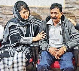 CM Mehbooba Mufti consoles the father of S Thirumani in Srinagar. Thirumani was killed in stone pelting in central Kashmir. | Zahoor Punjabi