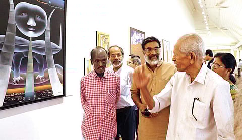 Prof M K Sanu, Nemom Pushparaj and Ponniyan Chandran at the Sargayanam painting exhibition at Durbar Hall in Kochi on Tuesday | Melton Antony