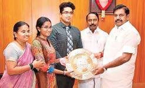 Chief Minister Edappadi K Palaniswami and Education Minister K A Sengottaiyan felicitating K A Villet Oviya on Monday,