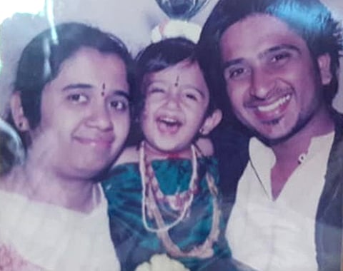 Meena with son Tushar and husband Chandan.