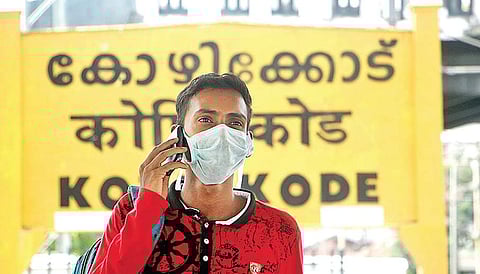In the wake of the Nipah virus outbreak, travellers from neighbouring districts take precautionary measures such as protective masks, while journeying to Kozhikode | T P Sooraj