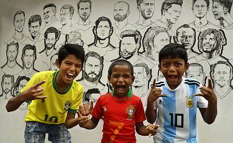 With just days remaining for the FIFA World Cup to begin in Russia, enthusiasm is bubbling over across football-crazy Kerala. Young fans raise a toast to their favourite teams in the backdrop of graffiti depicting the star players of all 32 teams in the W