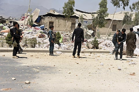 In this file photo, Security personnel inspect at the site of a deadly explosion in Kandahar, Afghanistan, Tuesday, May 22, 2018. (AP Photo)