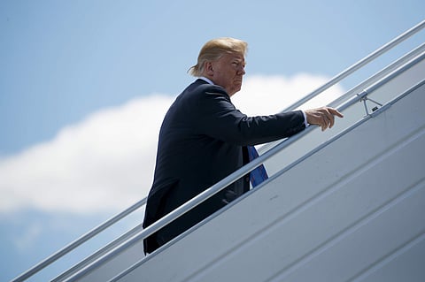 President Donald Trump boards Air Force One for a trip to Singapore to meet with North Korean leader Kim Jong Un, Saturday, June 9, 2018, at Canadian Forces Base Bagotville, in Canada. (AP)