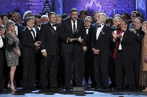 Orin Wolf, centre, and the cast and crew of 'The Band's Visit' accept the award for best musical. (AP)