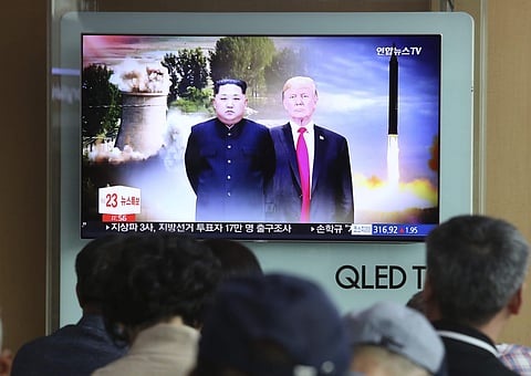 file footage of U.S. President Donald Trump, right, and North Korean leader Kim Jong Un during a news program at Seoul Railway Station in Seoul, South Korea, Monday, June 11, 2018. | AP