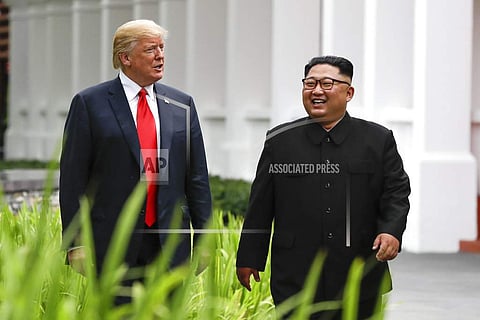 Kim Jong-Un and Donald Trump take a walk post lunch at the Singapore summit | AP