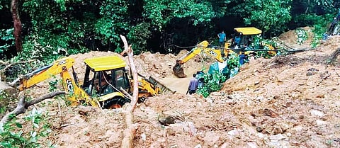 Excavators being used to clear debris on Charmadi Ghat on Tuesday | express