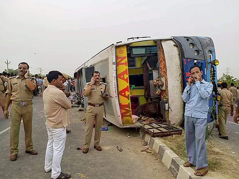 Mainpuri Police personnel conduct investigation at the site where an allegedly speeding bus overturned after hitting a road divider in Mainpuri on Wednesday June 13 2018. | PTI