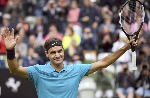 Roger Federer celebrates as he defeats Mischa Zverev during the ATP Mercedes Cup tournament in Stuttgart. | AP