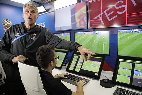 VAR refereeing Project Leader Roberto Rosetti, left, demonstrates a video operation room (VOR), a facility of the Video Assistant Referee (VAR) system which will be rolled out for the first time during the World Cup, at the 2018 World Cup International Br