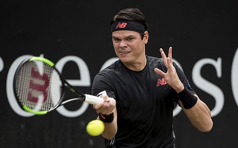 Milos Raonic returns the ball to Tomas Berdych in their quarterfinal match during the ATP Mercedes Cup in Stuttgart. | AP