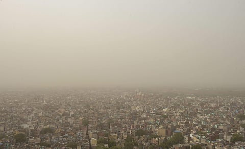 A thick blanket of dust and haze envelops the old city area of Delhi. (PTI)
