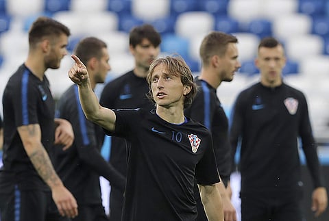 Croatia's Luka Modric points up during official training on the eve of the group D match against Nigeria | AP