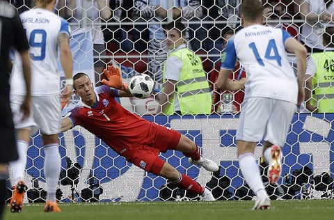 Iceland goalkeeper Hannes Halldorsson saves a penalty by Argentina's Lionel Messi during the group D match between Argentina and Iceland at the 2018 soccer World Cup in the Spartak Stadium in Moscow. | AP