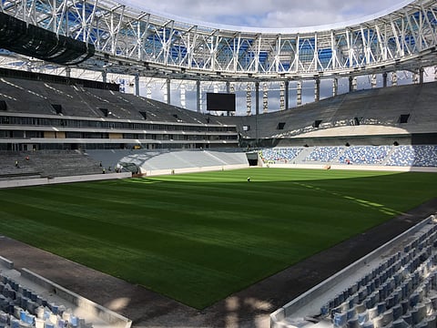 In this Saturday, Aug. 26, 2017 filer, laborers work at the construction site of the 2018 World Cup Nizhny Novgorod stadium, in Nizhny Novgorod, Russia. | AP