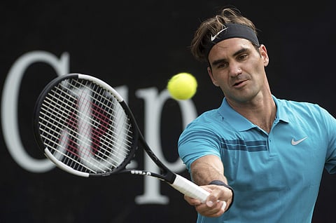 Roger Federer returns the ball to Nick Kyrgios in their semifinal tennis match during the ATP Mercedes Cup in Stuttgart. | AP
