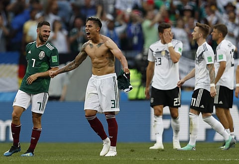 Mexico's Carlos Salcedo, second left, and Miguel Layun, left, react after Mexico defeated Germany in their group F match at the 2018 soccer World Cup in the Luzhniki Stadium in Moscow, Russia, Sunday, June 17, 2018. | AP