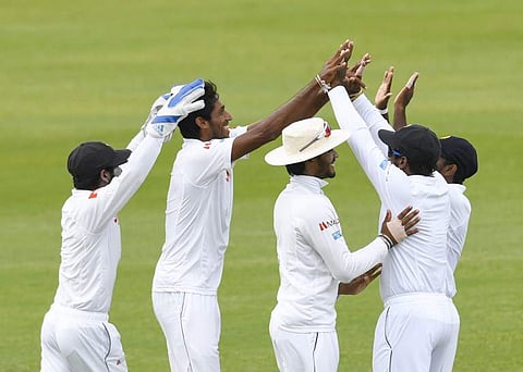 Kasun Rajitha (second left) of Sri Lanka celebrates the dismissal of Kieran Powell of West Indies during day 5 of the 2nd Test between West Indies and Sri Lanka at Daren Sammy Cricket Ground, Gros Islet, St. Lucia. (AFP)