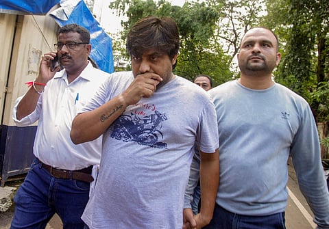 Saurabh Sahu being escorted by the Thane crime branch to the court for his alleged involvement in the Call Data Records (CDR) scam in Thane on Monday June 18 2018. | PTI