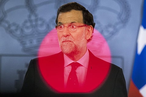 Spain's ousted Prime Minister Mariano Rajoy gestures during a press conference at the Moncloa Palace in Madrid, Spain. (AP Photo)