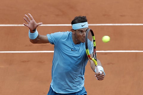 Spain's Rafael Nadal returns a ball to France's Richard Gasquet during their third round match of the French Open tennis tournament at the Roland Garros stadium, Saturday. (AP)