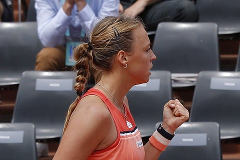 Estonia's Anett Kontaveit clenches her fist as she plays Petra Kvitova of the Czech Republic during their third round match of the French Open tennis tournament at the Roland Garros stadium, Saturday, June 2, 2018 in Paris. (AP Photo)