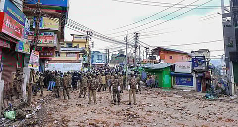 Shillong Securitymen stand guard a street during curfew in Shillong on Saturday. (PTI)