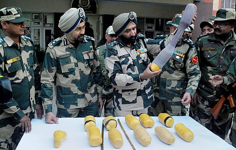 BSF officials showing heroin seized from Daoke Border Out Post BOP and Bhaoropal in Amritsar on Monday. (File photo | PTI)