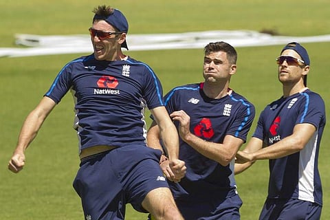 England pacer Craig Overton (L) | AFP
