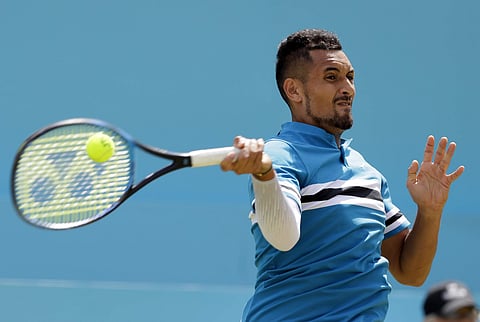 Nick Kyrgios of Australia plays a return to Kyle Edmund of Britain during their singles tennis match at the Queen's Club tennis tournament in London. (AP)