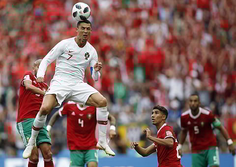 Portugal's Cristiano Ronaldo leaps up for a header during the group B match between Portugal and Morocco at the 2018 soccer World Cup in the Luzhniki Stadium in Moscow, Russia, Wednesday, June 20, 2018. | AP