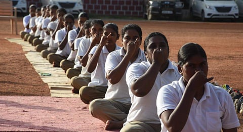 Police Personnel performing Yoga in Vijayawada on Thursday. (EPS | RVK Rao)