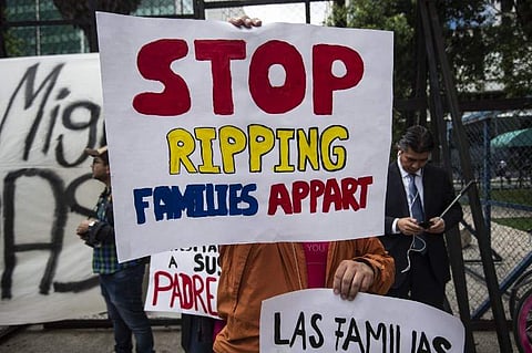 Trump ordered an end to the separation of migrant children from their parents on the US border Wednesday. IN PIC: People take part in a protest against US immigration policies outside the US embassy in Mexico City on June 21, 2018. | AFP