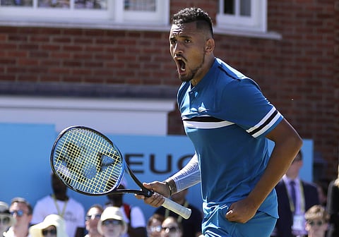 Nick Kyrgios of Australia celebrates winning his quarterfinal tennis match against Feliciano Lopez of Spain at the Queen's Club tennis tournament in London. (AP)
