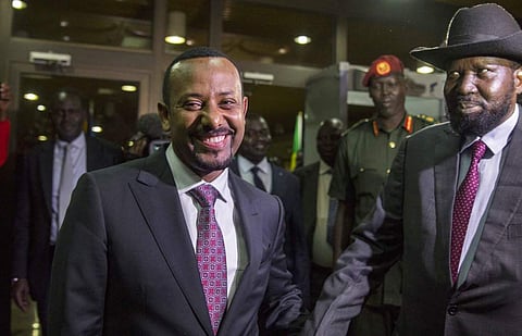 South Sudan's President Salva Kiir, right, is greeted by Ethiopia's Prime Minister Abiy Ahmed, left, as he arrives at the office of Ethiopia's Prime Minister for a meeting with South Sudan's opposition leader Riek Machar, in Addis Ababa, Ethiopia. | AP