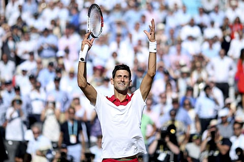 Serbia's Novak Djokovic celebrates beating France's Adrian Mannarino 7-5, 6-1 during a quarter-finals match of the Fever-Tree Championship at the Queen's Club, London, Friday June 22, 2018. | AP