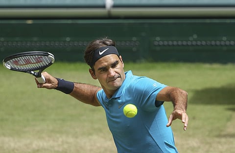 Roger Federer returns the ball to Denis Kudla during their semi final match at the Gerry Weber Open ATP tennis tournament in Halle. | AP