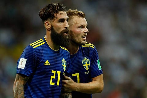 Sweden's midfielder Jimmy Durmaz (L) and Sweden's midfielder Sebastian Larsson (R) react at the end of the Russia 2018 World Cup Group F football match between Germany and Sweden at the Fisht Stadium in Sochi. | AP