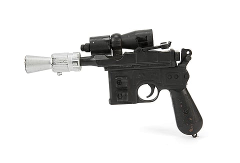 This photo provided by Julien's Auctions shows character Han Solo's BlasTech DL-44 blaster from the Star Wars trilogy film 'Return of the Jedi' | AP
