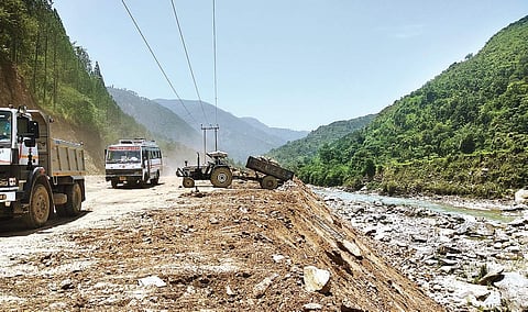 A tractor trolley dumping road construction material into the river Mandakini near Rudraprayag in Uttarakhand | Express Photo Services