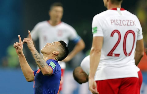 Colombia's Wilmar Barrios, left, kneels on the pitch at the end of the group H match between Poland and Colombia at the 2018 soccer World Cup at the Kazan Arena in Kazan, Russia, Sunday, June 24, 2018. | Associated Press