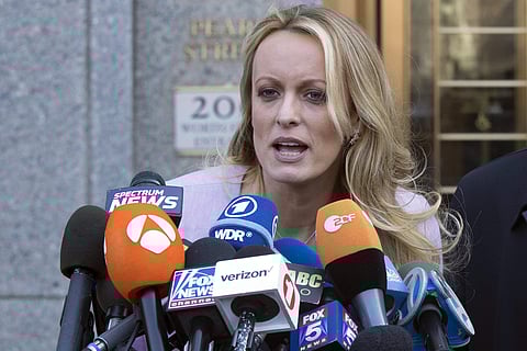 In this April 16, 2018, file photo, adult film actress Stormy Daniels speaks outside federal court, in New York. According to a person familiar with the matter, on Monday, June 25, 2018, Daniels will meet with federal prosecutors in New York who are inves